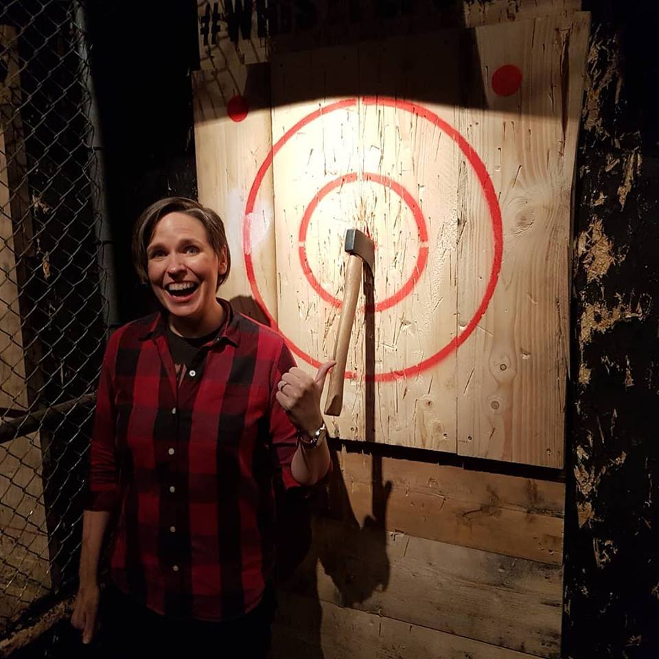 Comedian Kate McCabe shows off her axe throwing chops